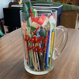 Vintage novelty huge glass “I Dare You” beer mug full of cocktail stirrers